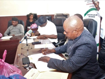 JFirst right, Mr. Garba Gowon Gonkol, ACReSAL State Project Coordinator, Plateau state signing the contract document on behalf of Governor Caleb Mutfwang